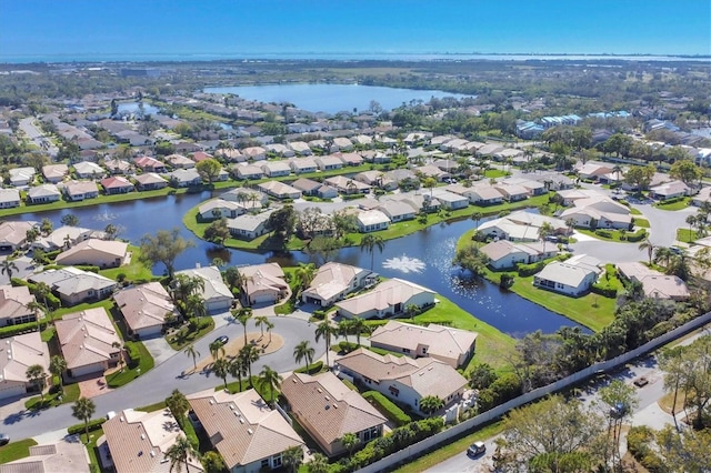 bird's eye view featuring a residential view and a water view