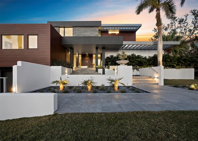 contemporary house featuring stone siding