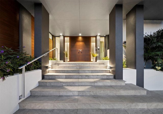 entrance to property featuring stucco siding