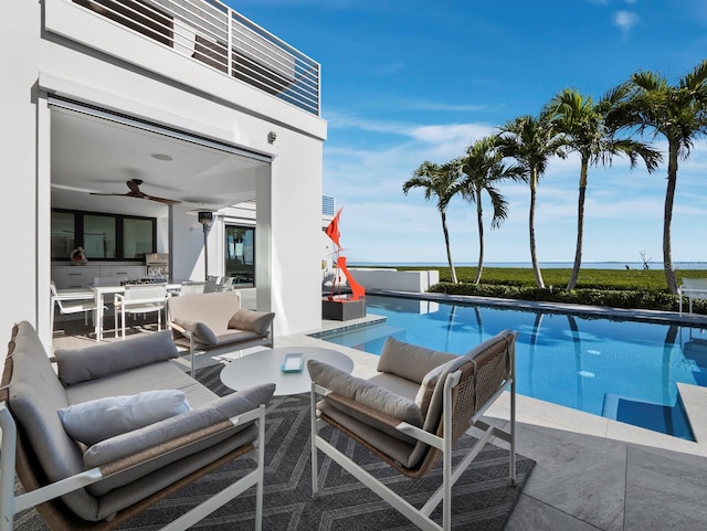 pool featuring a patio area, outdoor dining space, outdoor lounge area, and a ceiling fan