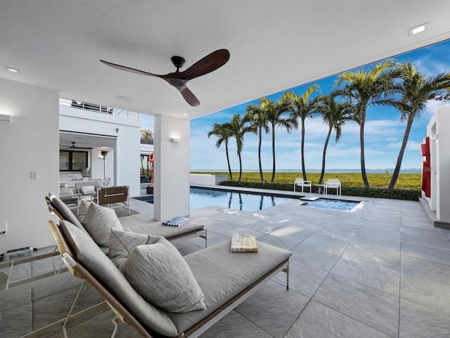 view of swimming pool featuring a ceiling fan