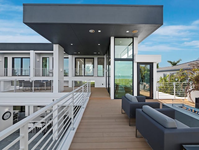 wooden deck with an outdoor hangout area