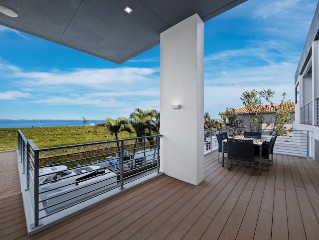 wooden deck with a water view