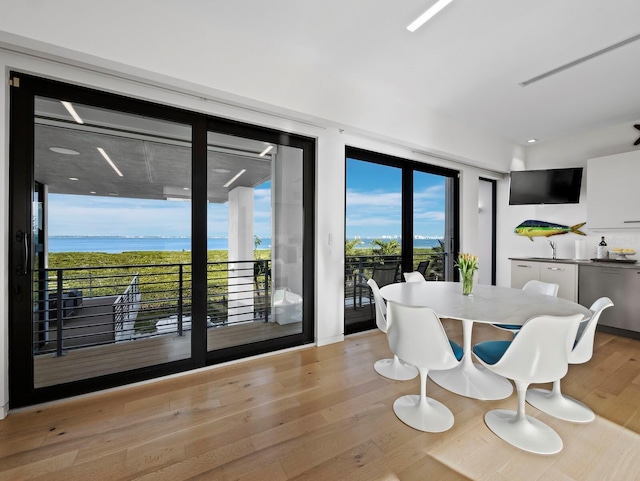 dining area featuring light wood finished floors