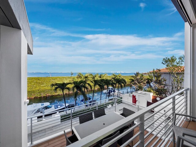 balcony featuring a water view