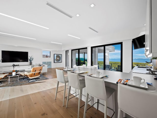 dining room featuring wood finished floors and visible vents