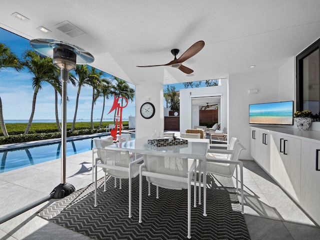 interior space with a ceiling fan, outdoor dining area, visible vents, and an outdoor pool