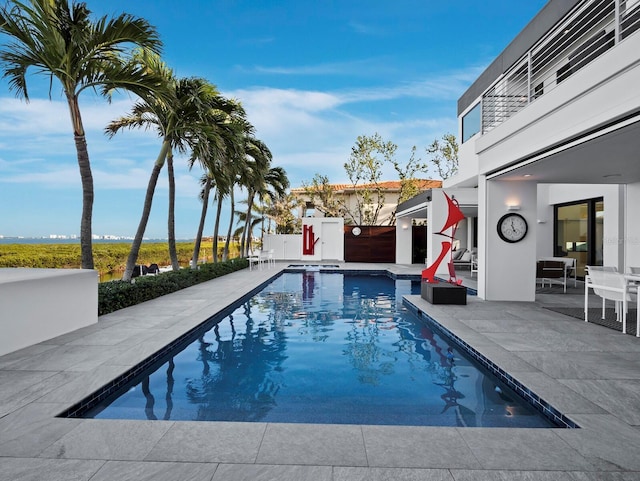 view of swimming pool featuring a patio area and a fenced in pool