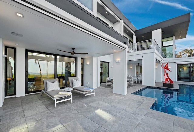 exterior space featuring a patio area and a ceiling fan