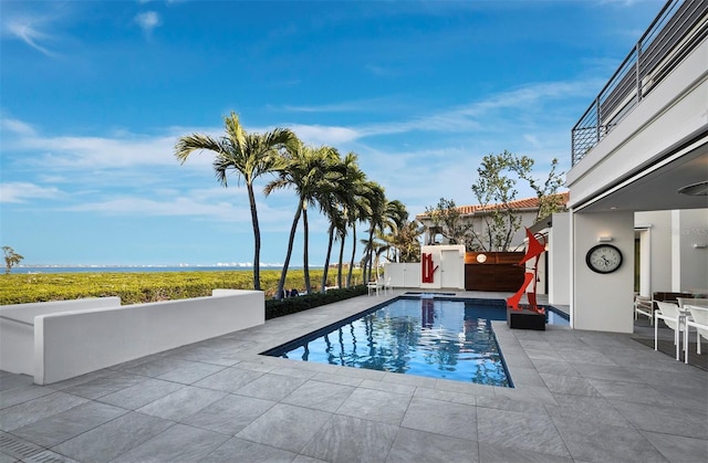 view of pool with a fenced in pool and a patio