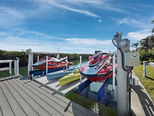 view of dock with a water view and boat lift