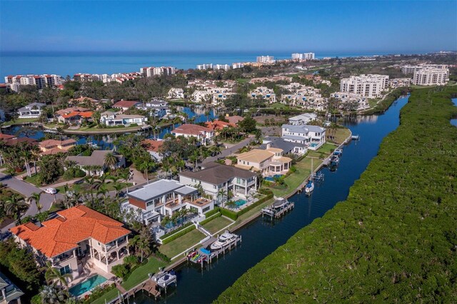 birds eye view of property featuring a water view and a residential view