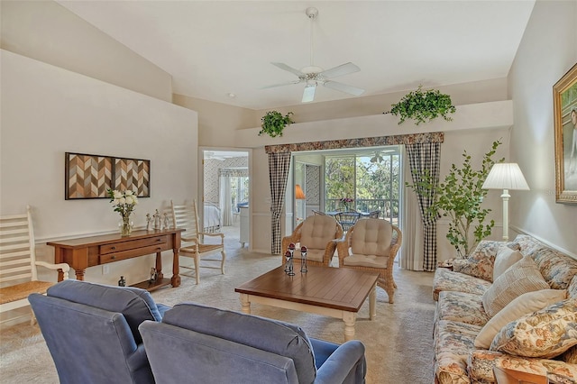 living room featuring light carpet, ceiling fan, and lofted ceiling