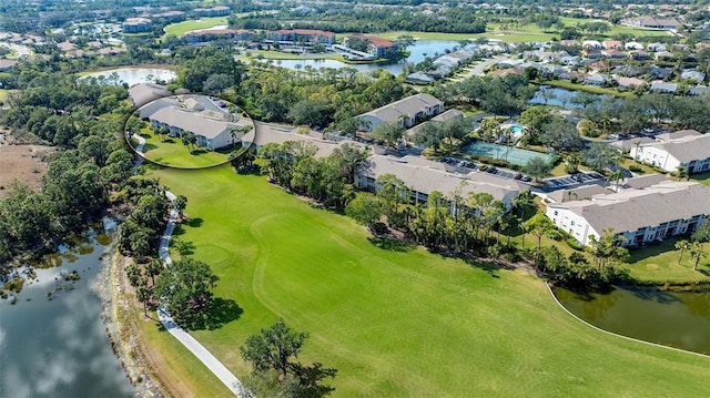 aerial view featuring a residential view, view of golf course, and a water view