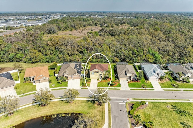 aerial view featuring a residential view and a view of trees