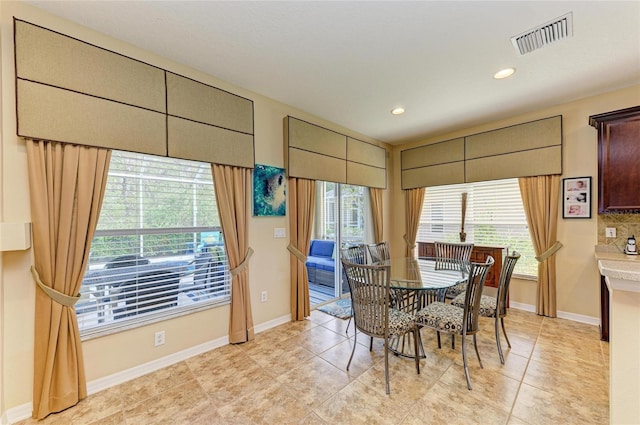 dining area with recessed lighting, light tile patterned flooring, visible vents, and baseboards