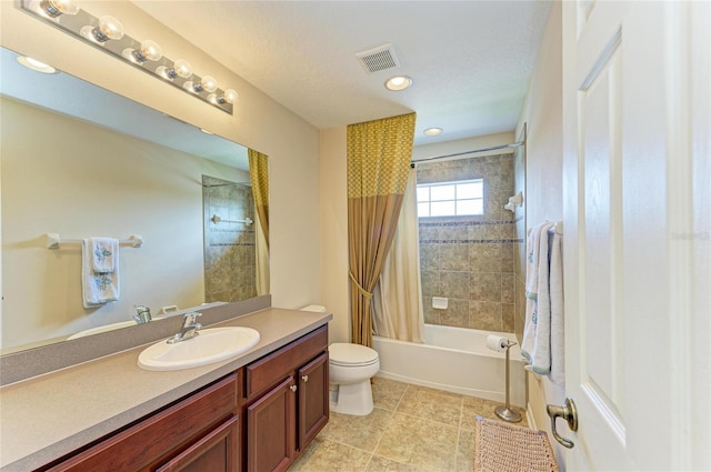 bathroom featuring visible vents, toilet, shower / tub combo with curtain, tile patterned floors, and vanity