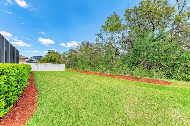 view of yard featuring fence