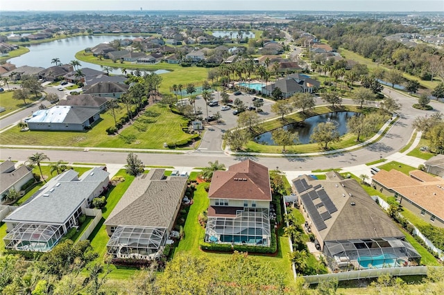 bird's eye view with a water view and a residential view