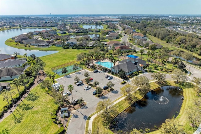 bird's eye view with a water view and a residential view