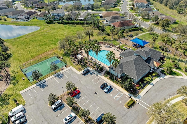 birds eye view of property with a residential view and a water view