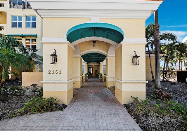 property entrance featuring stucco siding