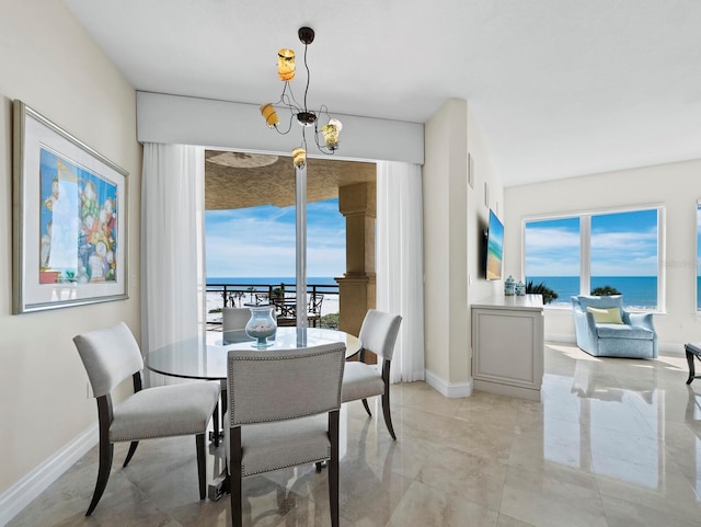 dining area featuring plenty of natural light and baseboards