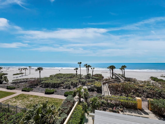 water view with a view of the beach and fence