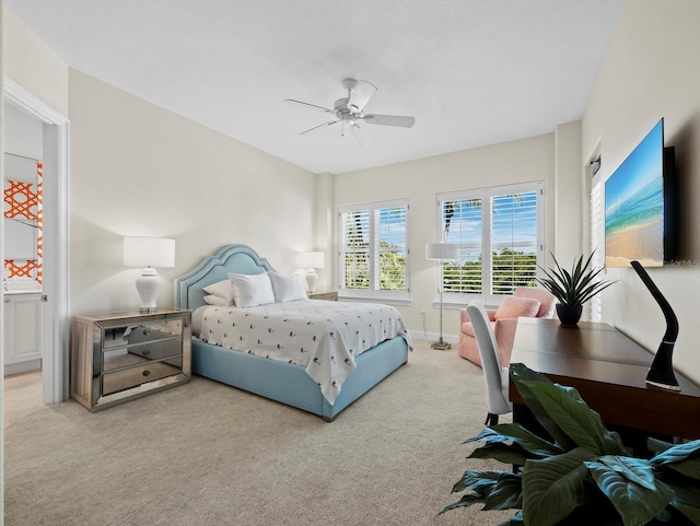 carpeted bedroom featuring a ceiling fan and baseboards