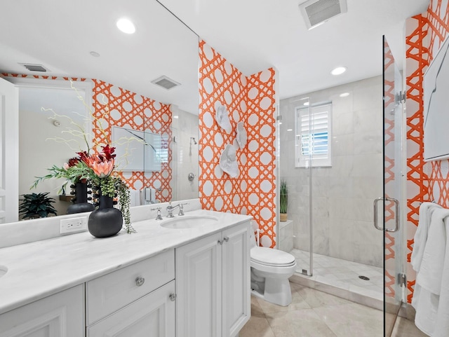 full bathroom with visible vents, vanity, toilet, and a shower stall