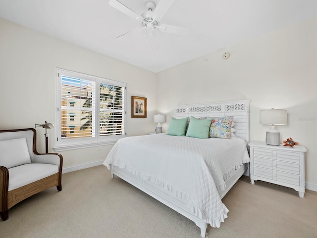 bedroom with baseboards, carpet, and a ceiling fan