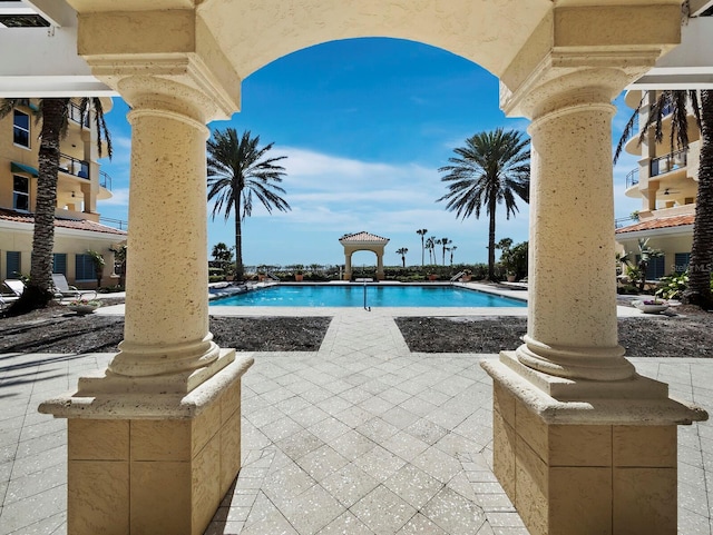 community pool with a patio