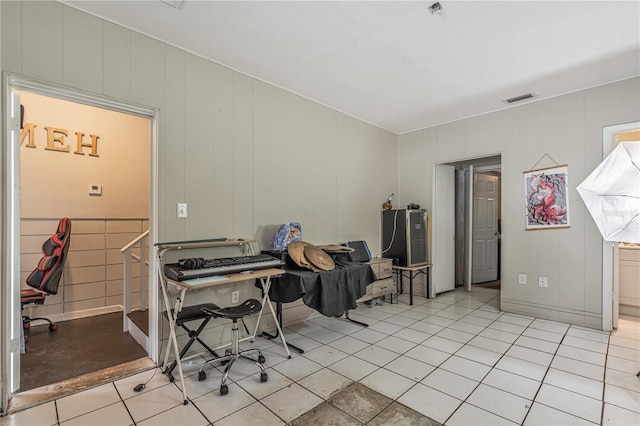 office space featuring visible vents and light tile patterned floors