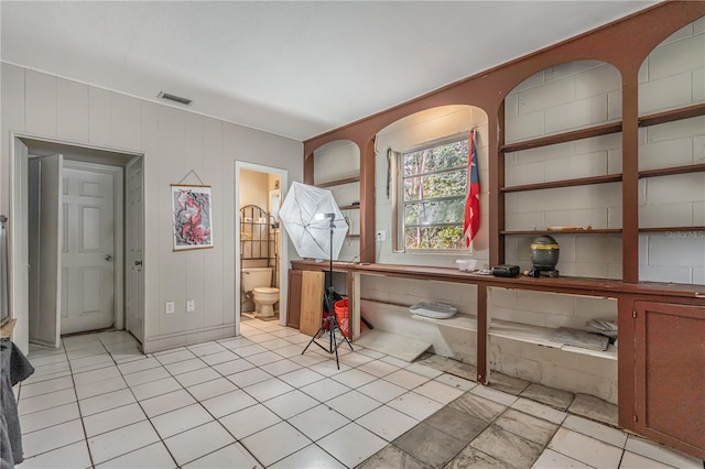 interior space featuring toilet and visible vents