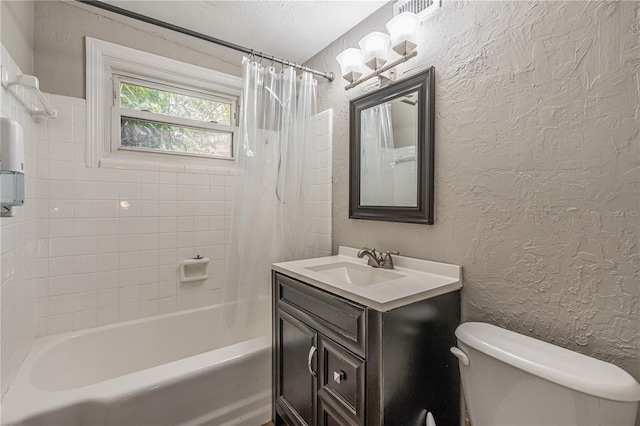 full bath featuring a textured ceiling, a textured wall, toilet, vanity, and shower / bathtub combination with curtain