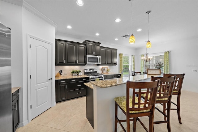 kitchen with light tile patterned floors, visible vents, an inviting chandelier, stainless steel appliances, and backsplash