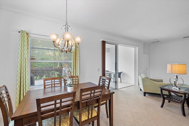 dining room featuring light tile patterned floors, ornamental molding, and a chandelier