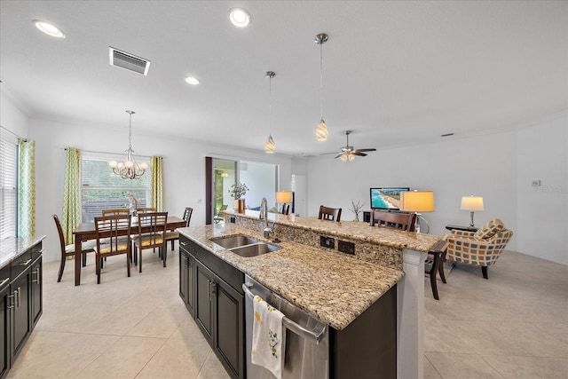 kitchen with visible vents, hanging light fixtures, light tile patterned flooring, a sink, and dishwasher