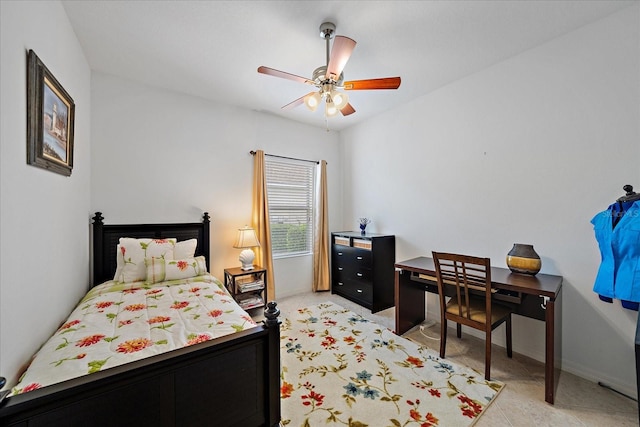 bedroom featuring ceiling fan and baseboards