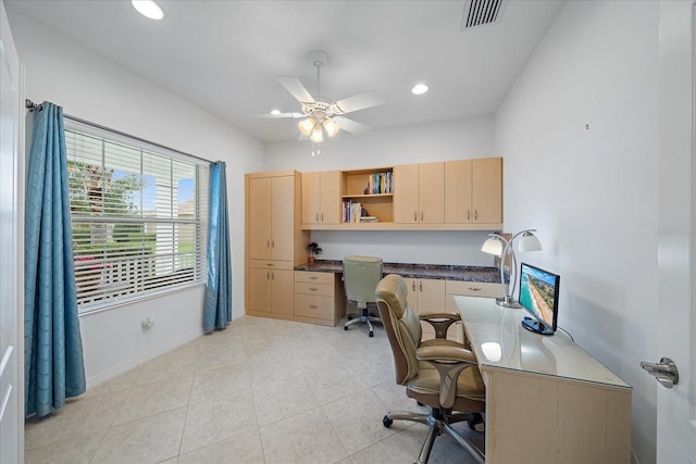 office space featuring recessed lighting, a ceiling fan, baseboards, visible vents, and built in study area