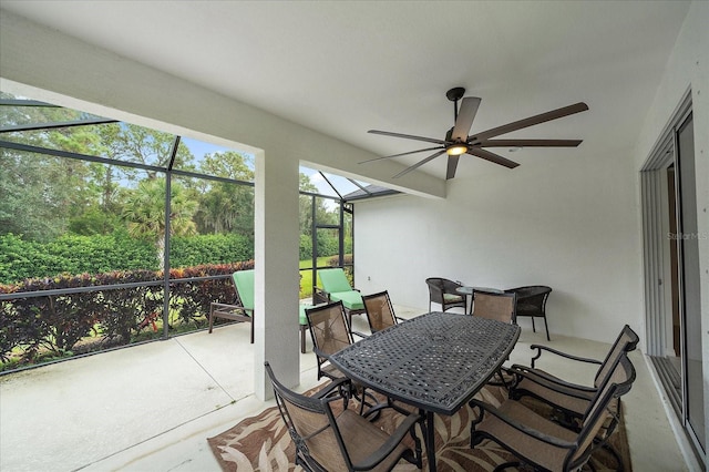 sunroom / solarium with a ceiling fan