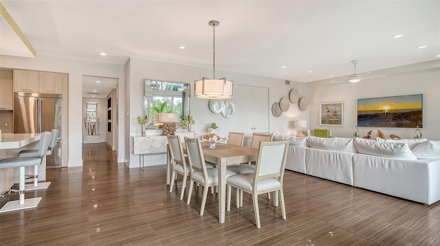 dining space with baseboards, a ceiling fan, and recessed lighting