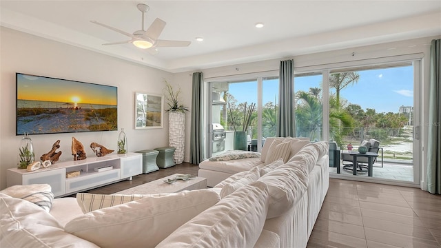 living room with ceiling fan and recessed lighting