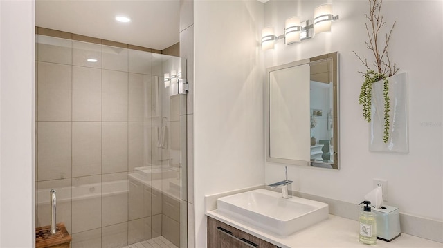 bathroom with a sink and a shower stall