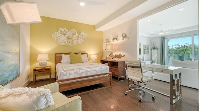 bedroom featuring a ceiling fan, baseboards, and wood finished floors