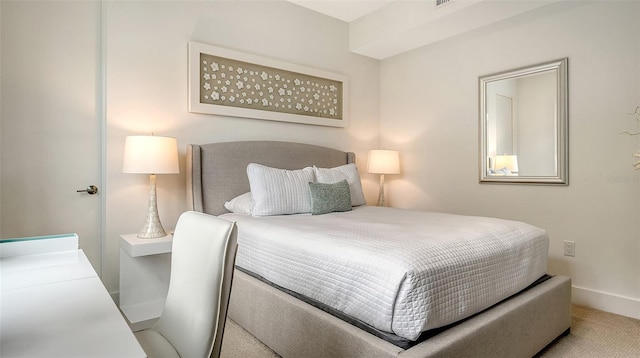 bedroom with carpet floors and baseboards