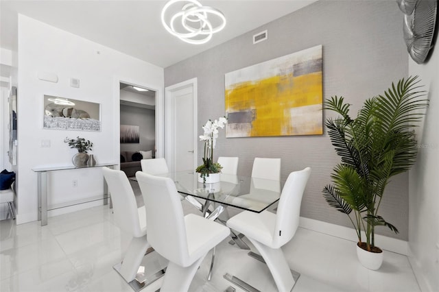 dining room with baseboards, visible vents, a chandelier, and light tile patterned flooring