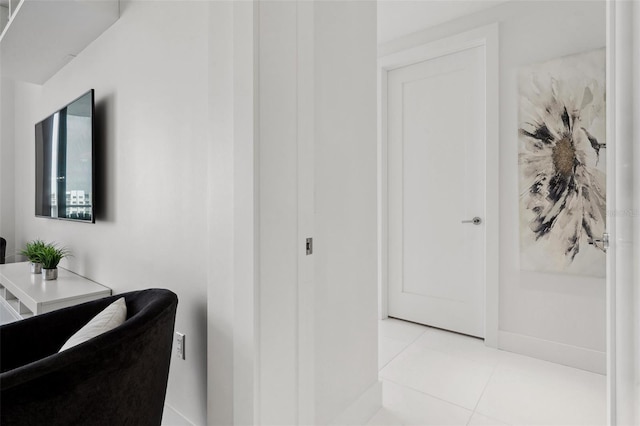 bathroom with tile patterned flooring and baseboards