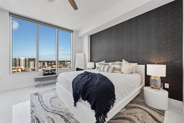 bedroom featuring ceiling fan and tile patterned floors