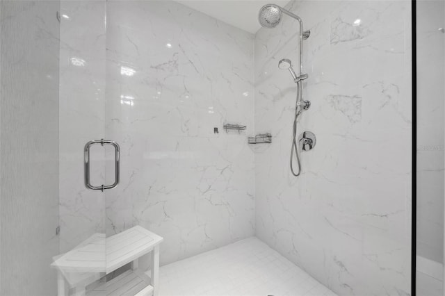 full bathroom featuring a marble finish shower